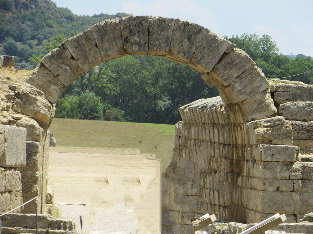 arch heading out onto the gaming field in Olympia Greece