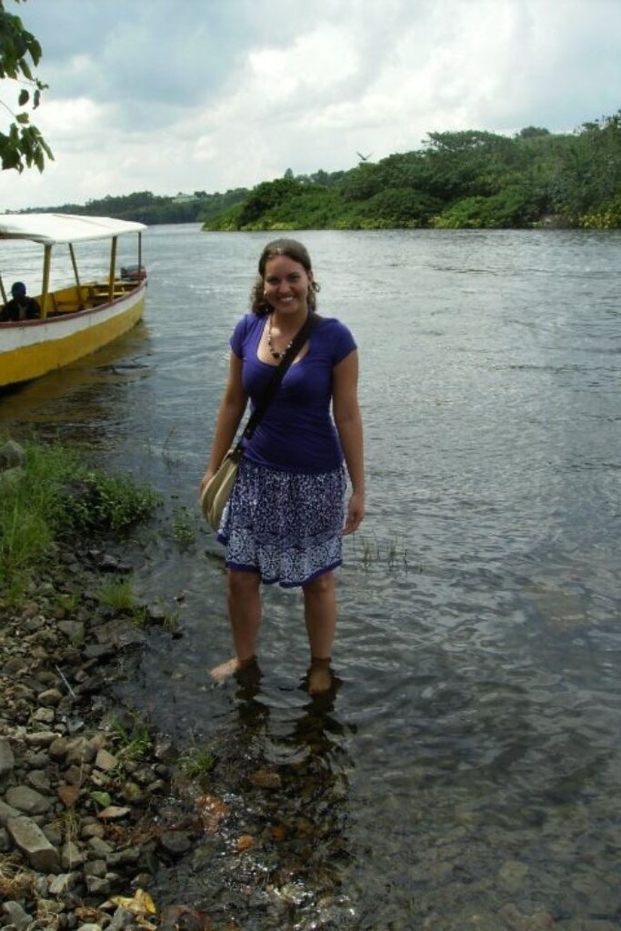 girl standing in the Nile River in Uganda Africa