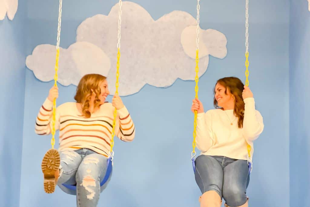 photo with a cloud backdrop at selfie studio on a girls weekend in Denver