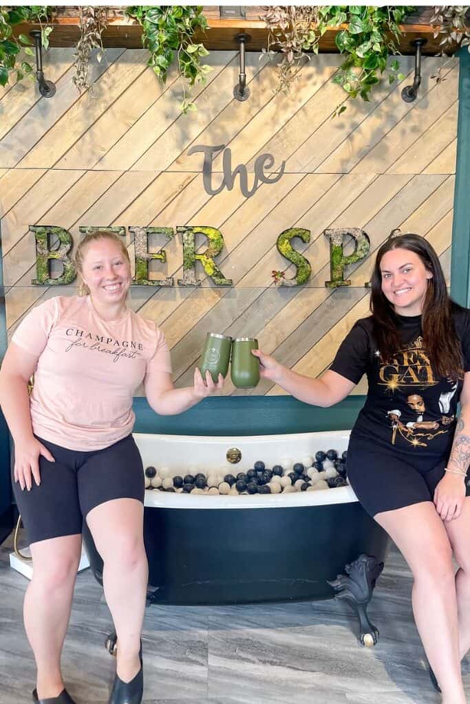 two girls relaxing at the beer spa in Denver on a girls weekend